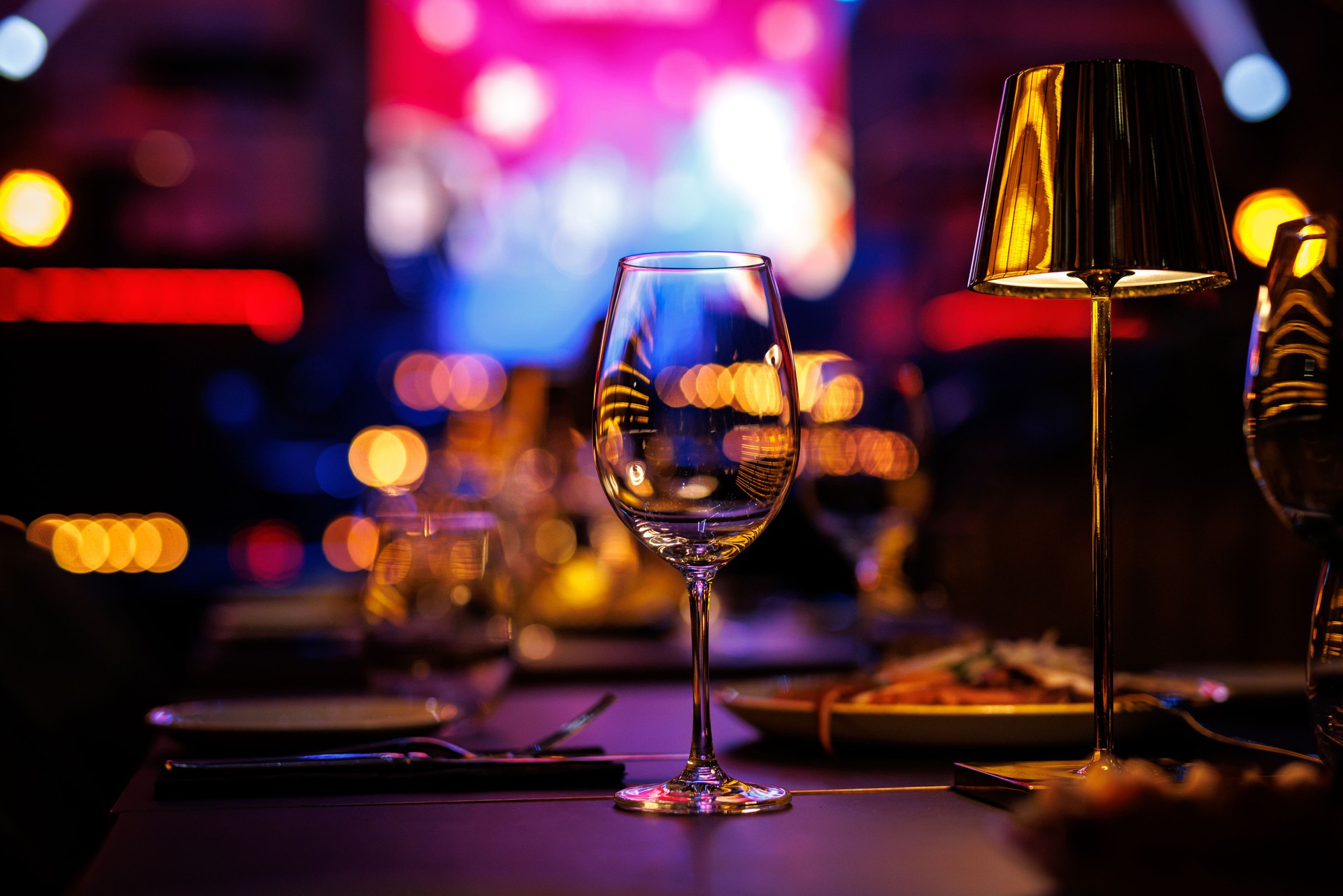 Served table in a restaurant at the holiday. Empty glasses before the event